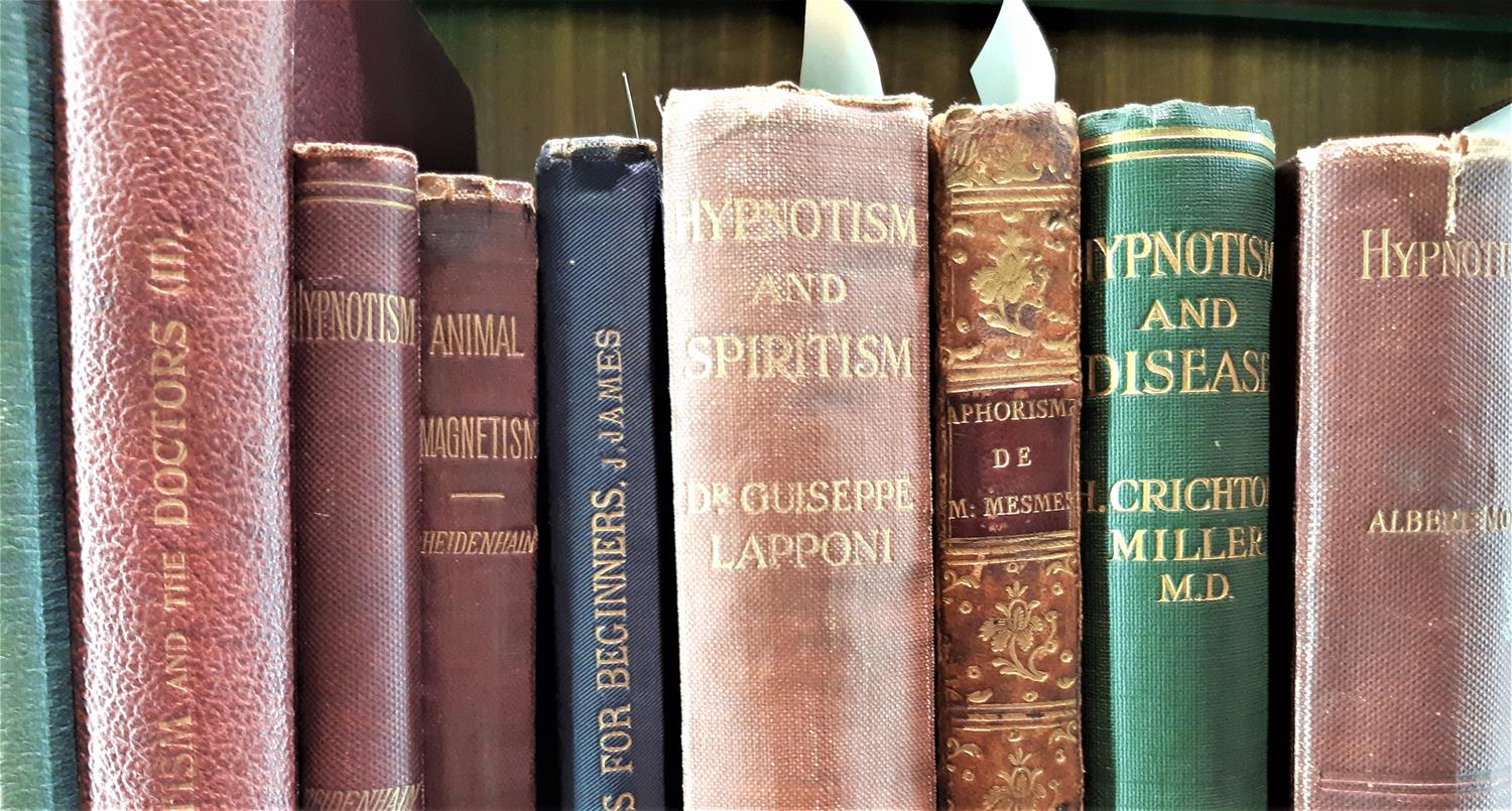 Spines of books on hypnotism