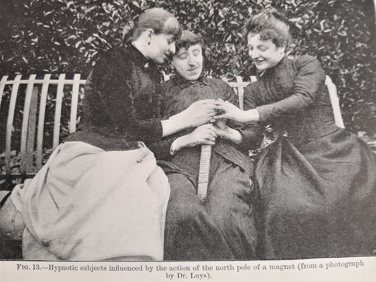 Photograph of female hypnotic subjects 'influenced by a magnet'