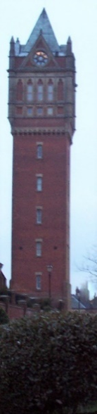 Red brick tower of at least 5 storeys