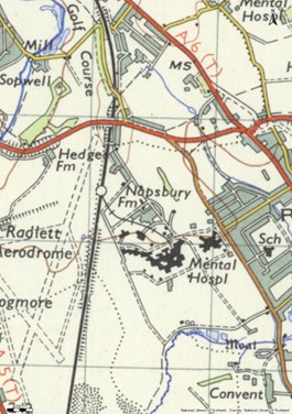 OS style map in colour showing a large building complex labelled Mental Hospl near Napsbury FM. There is a train line running through the area.