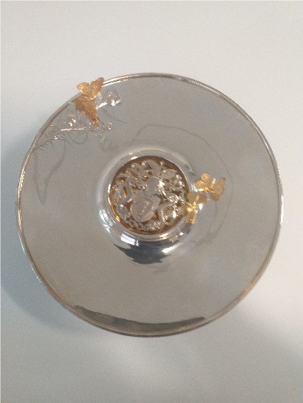 Silver bowl with gold trim, butterflies and the college crest