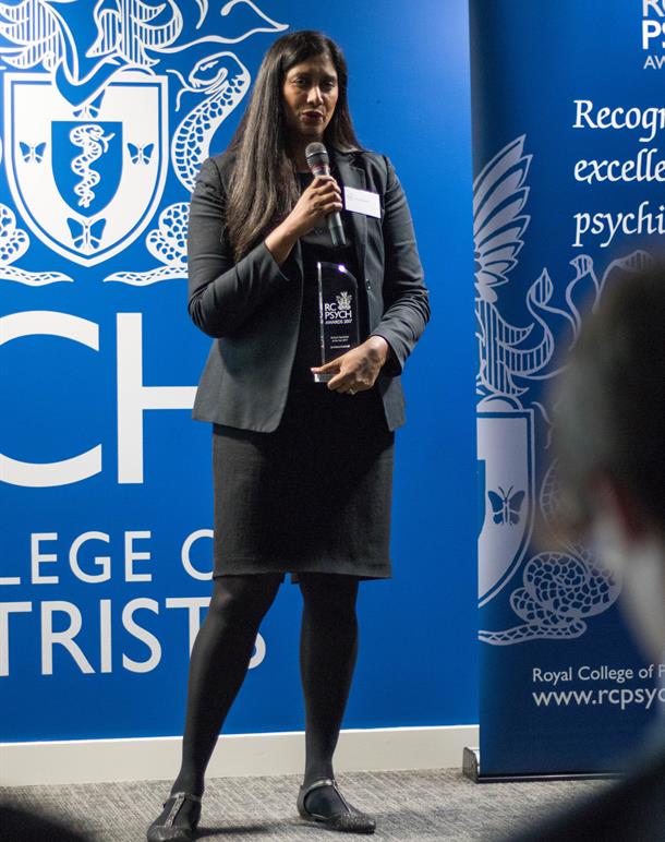Shree at mic portrait blue background