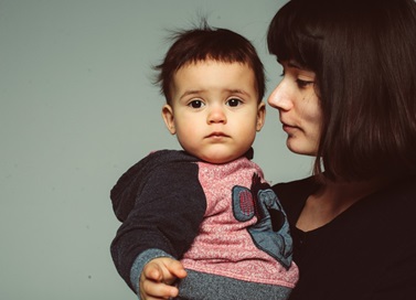 mother holding infant son